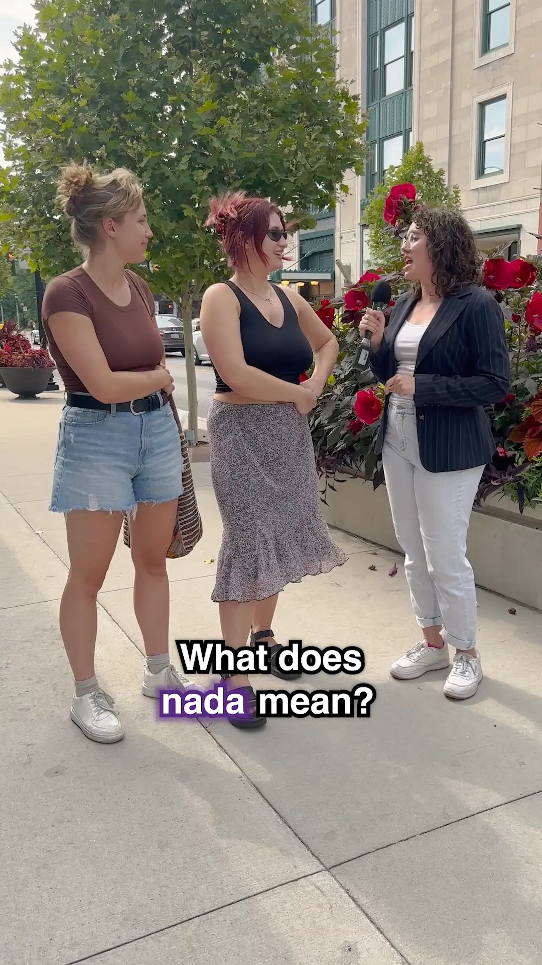 a woman with a microphone asks people on the street, 