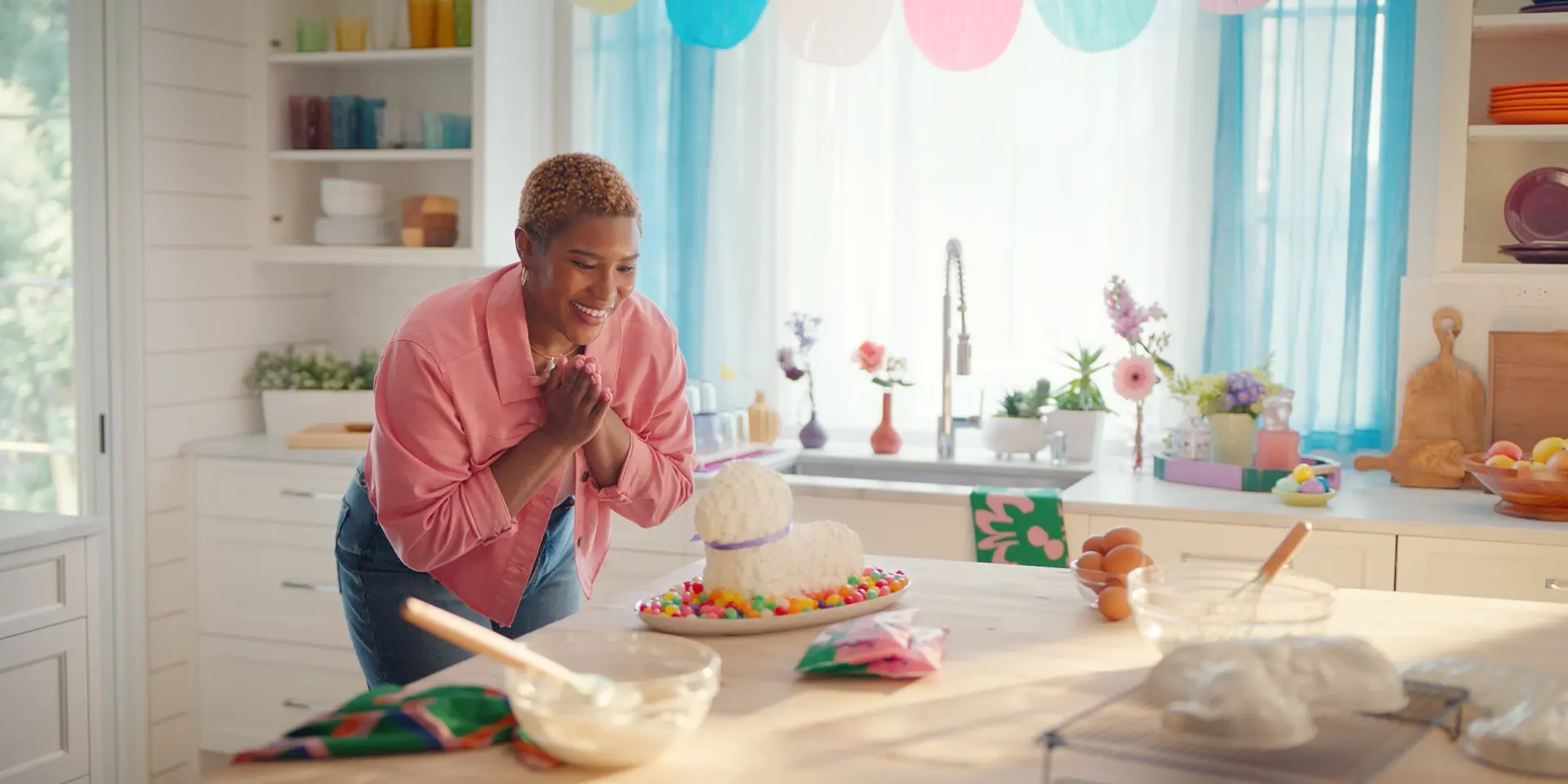 a woman makes an Easter lamb cake decorated with Brach's candies