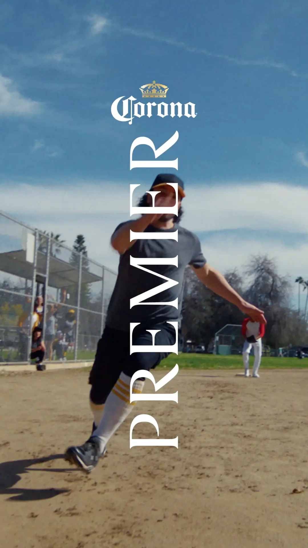 the Corona Premier logo superimposed over a softball game