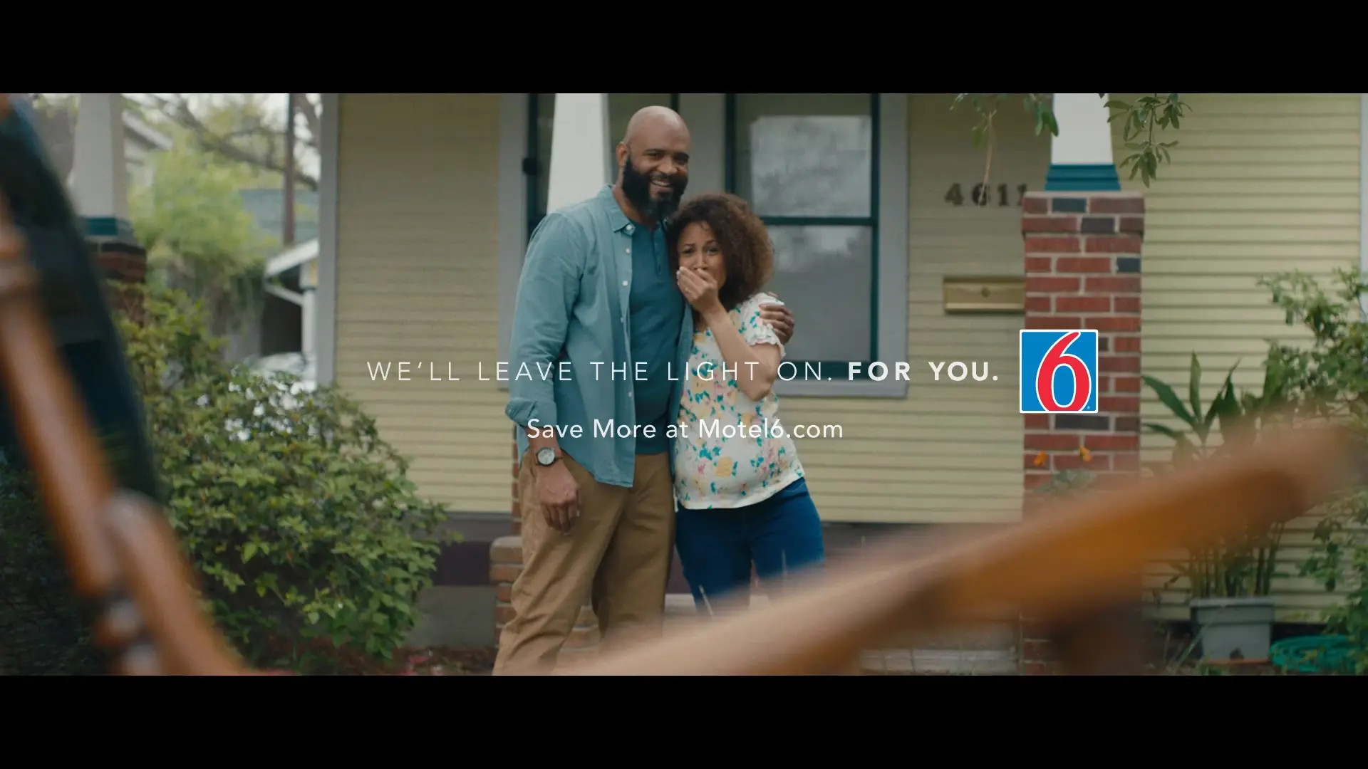 a man and a woman hug, with the Motel 6 slogan 