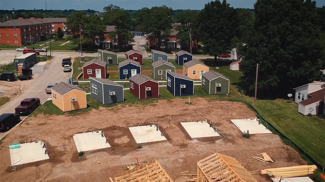 an empty lot where temporary housing is being built for homeless veterans